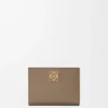 Anagram Compact Wallet in Pebble Grained Calfskin Anagram Compact Wallet in Pebble Grained Calfskin