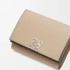 Anagram Trifold Wallet in Pebble Grained Calfskin Anagram Trifold Wallet in Pebble Grained Calfskin